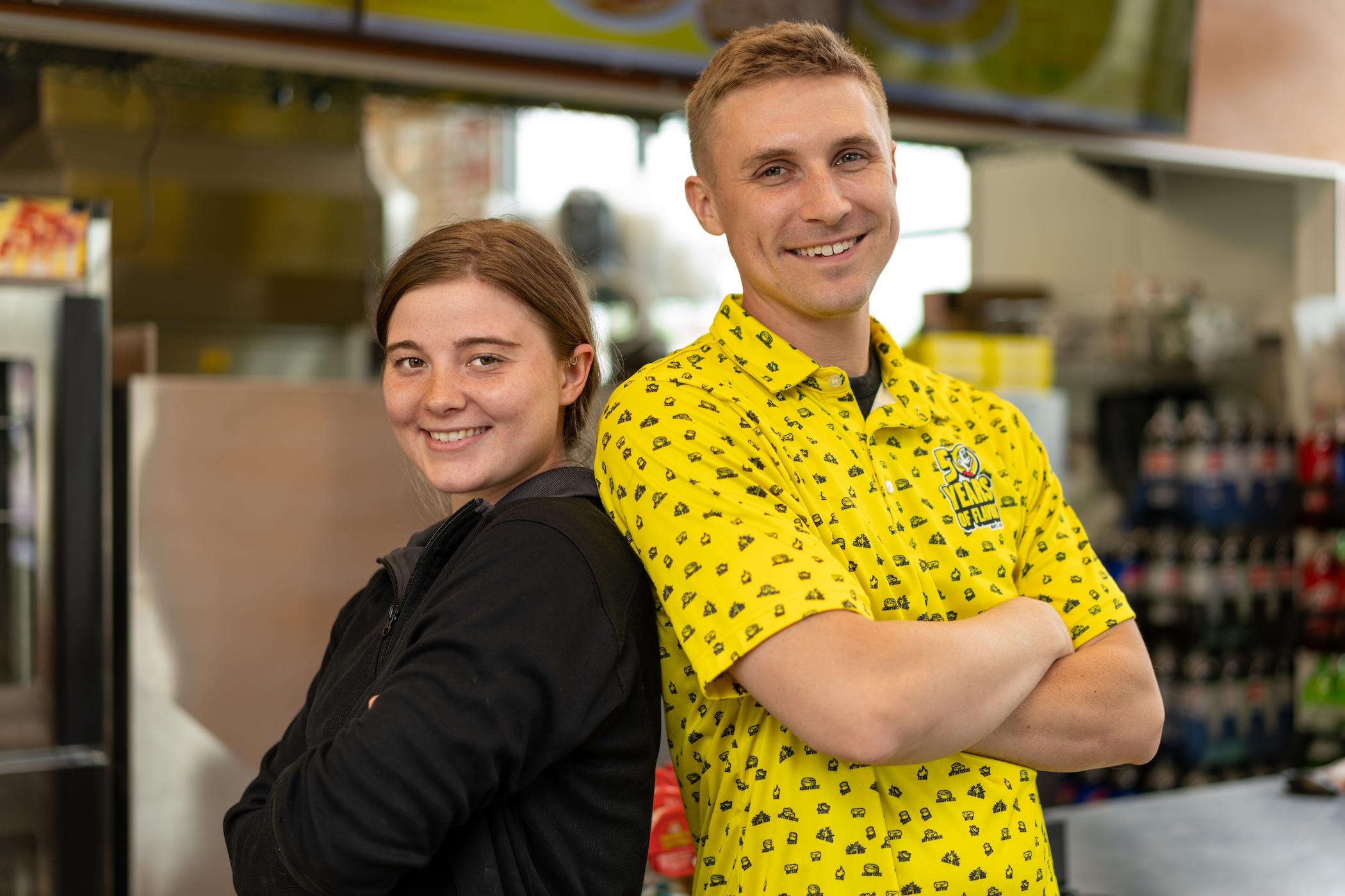Two smiling hungry howie's employees